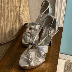 New, unused Guess Silver size 7 heels.